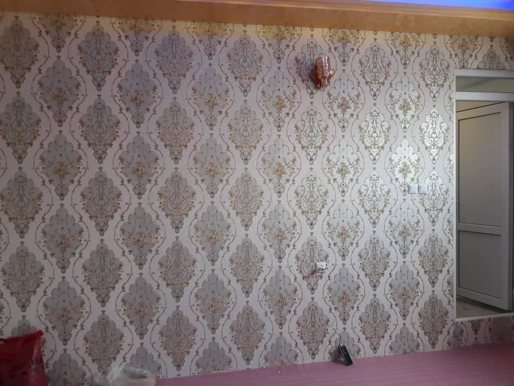 Feature wall finished with a gold and grey damask mural